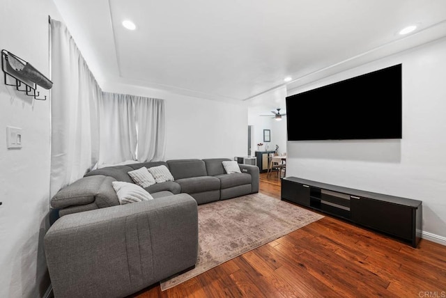 living area with a ceiling fan, recessed lighting, and wood finished floors