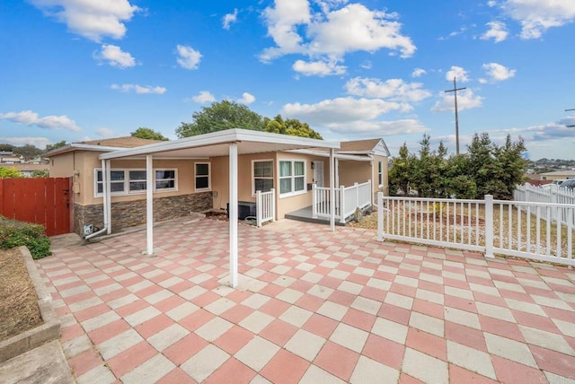 view of patio featuring fence