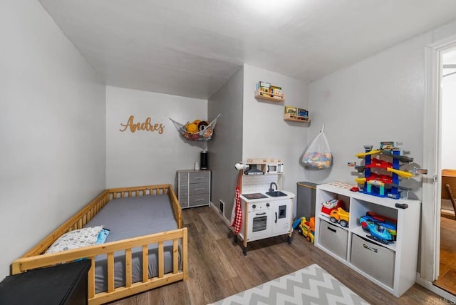 recreation room featuring wood finished floors