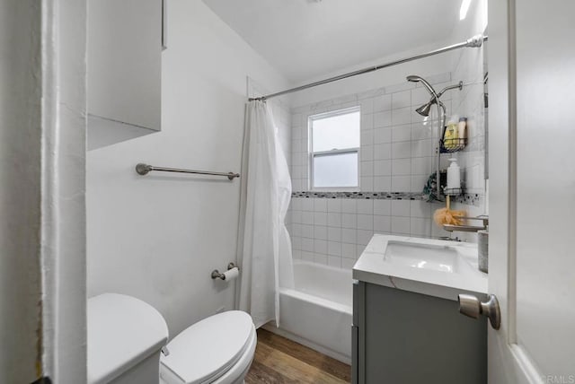 bathroom with toilet, vanity, shower / bath combination with curtain, and wood finished floors