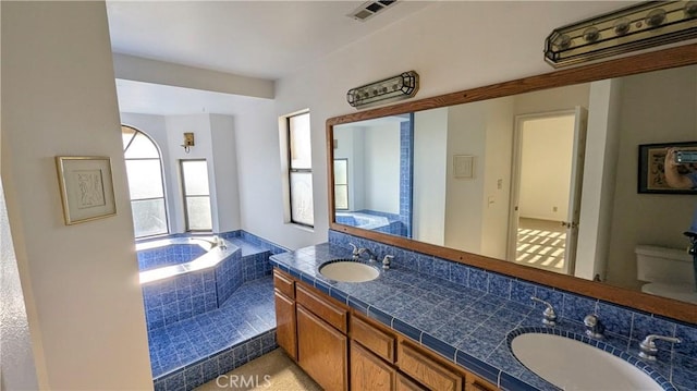 100 S Lucia Ave Unit 1, Redondo Beach, CA 90277 - bathroom with double vanity, toilet, and a garden tub