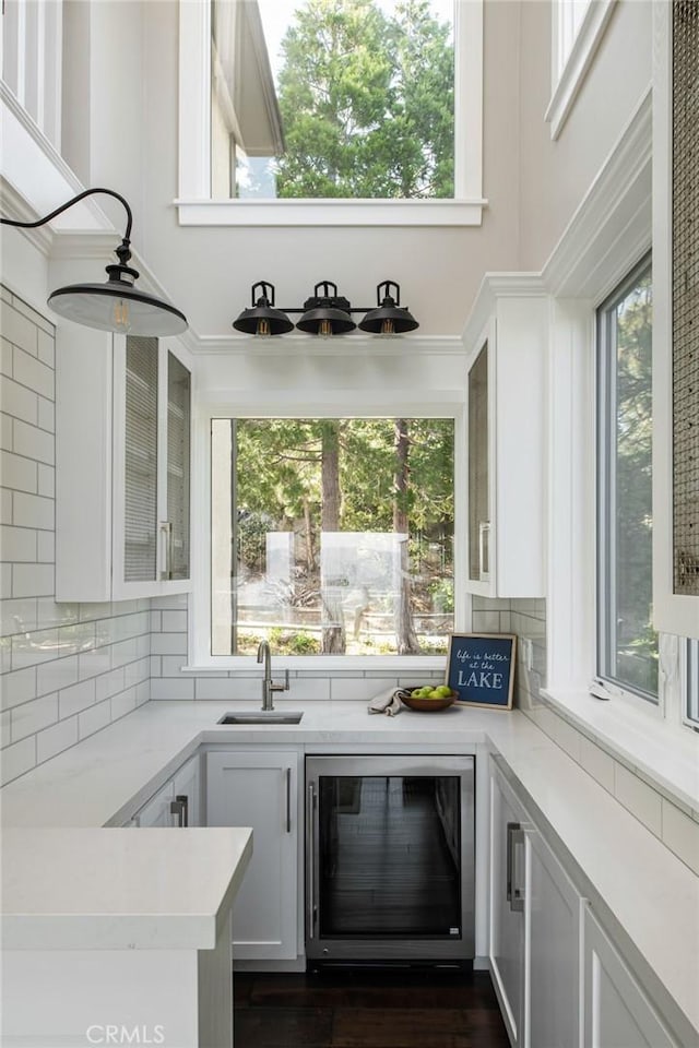 27417 Matterhorn Dr, Lake Arrowhead, CA 92352 - bar featuring backsplash, a sink, and wine cooler