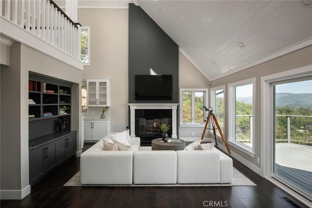 27417 Matterhorn Dr, Lake Arrowhead, CA 92352 - living area with high vaulted ceiling, visible vents, baseboards, a glass covered fireplace, and dark wood-style floors