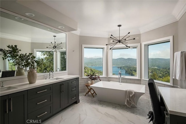 27417 Matterhorn Dr, Lake Arrowhead, CA 92352 - bathroom with ornamental molding, a notable chandelier, and a sink