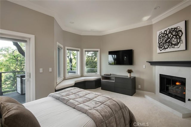 27417 Matterhorn Dr, Lake Arrowhead, CA 92352 - carpeted bedroom featuring multiple windows, ornamental molding, access to outside, and a glass covered fireplace