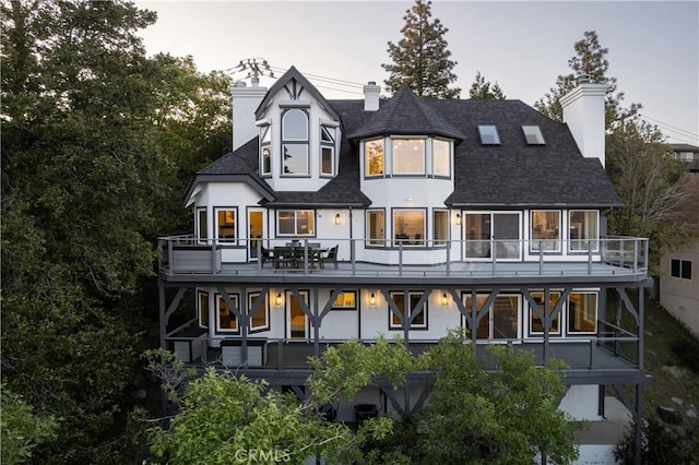 27417 Matterhorn Dr, Lake Arrowhead, CA 92352 - rear view of property with a shingled roof, a chimney, and a balcony