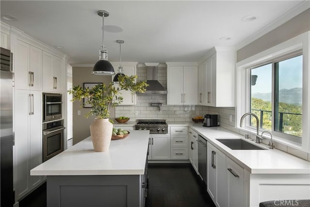 27417 Matterhorn Dr, Lake Arrowhead, CA 92352 - kitchen featuring a sink, wall chimney exhaust hood, a kitchen island, backsplash, and light countertops