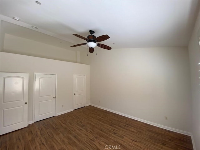 additional living space featuring baseboards, ceiling fan, and wood finished floors
