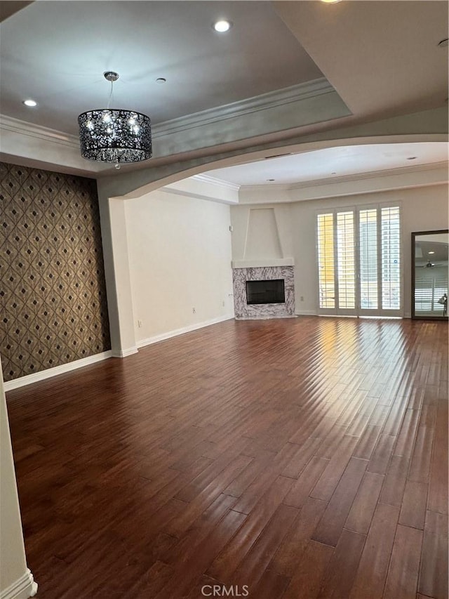14535 Margate St Unit 12, Sherman Oaks, CA 91411 - unfurnished living room featuring ornamental molding, baseboards, dark wood-style flooring, a high end fireplace, and a chandelier