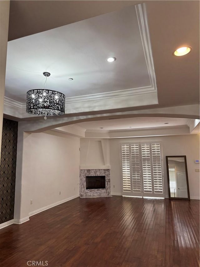 14535 Margate St Unit 12, Sherman Oaks, CA 91411 - unfurnished living room featuring a raised ceiling, baseboards, wood finished floors, a premium fireplace, and a chandelier