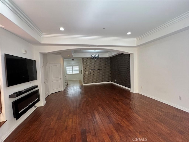 14535 Margate St Unit 12, Sherman Oaks, CA 91411 - unfurnished living room featuring arched walkways, a tray ceiling, wood-type flooring, ornamental molding, and baseboards