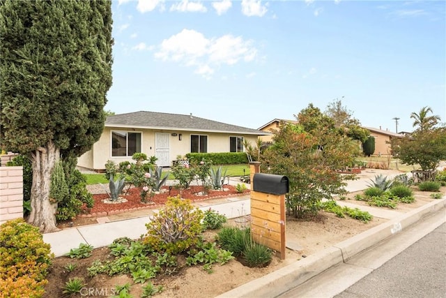 11348 Ramona Ave, Pomona, CA 91766 - view of front facade with a shingled roof and stucco siding