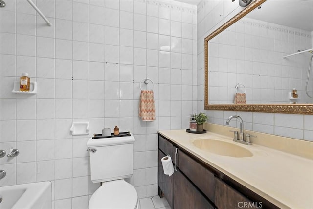 11348 Ramona Ave, Pomona, CA 91766 - bathroom with tile walls, toilet, tub / shower combination, and vanity