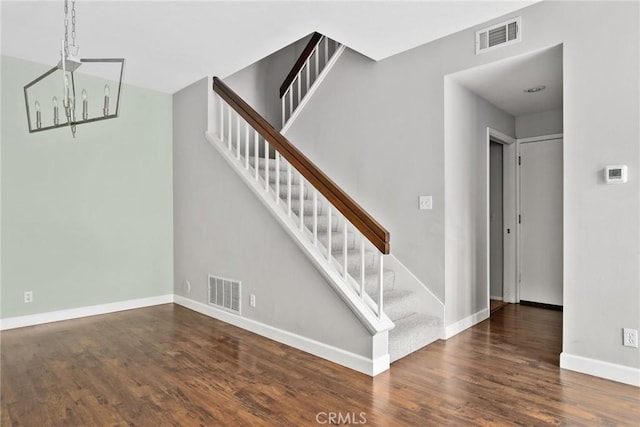 1092 Amberton Ln, Newbury Park, CA 91320 - staircase featuring a chandelier, wood finished floors, and baseboards