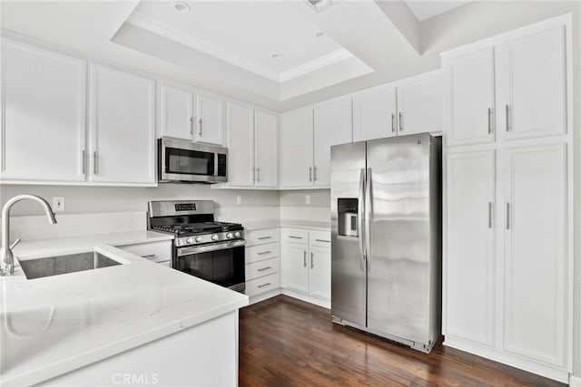 1092 Amberton Ln, Newbury Park, CA 91320 - kitchen with appliances with stainless steel finishes, a sink, light stone countertops, white cabinets, and dark wood-style floors