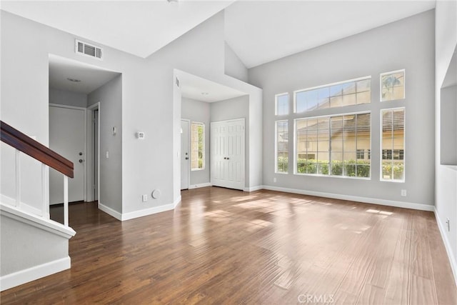 1092 Amberton Ln, Newbury Park, CA 91320 - unfurnished living room featuring baseboards, wood finished floors, stairs, and a high ceiling