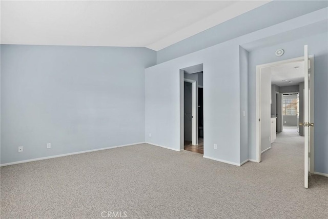 1092 Amberton Ln, Newbury Park, CA 91320 - spare room featuring light carpet, baseboards, lofted ceiling, and a smoke detector