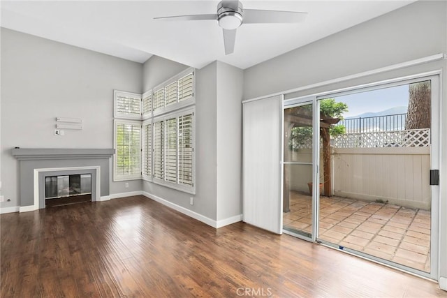 1092 Amberton Ln, Newbury Park, CA 91320 - unfurnished living room with plenty of natural light, wood finished floors, and a ceiling fan