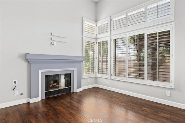 1092 Amberton Ln, Newbury Park, CA 91320 - unfurnished living room featuring baseboards, a glass covered fireplace, and wood finished floors