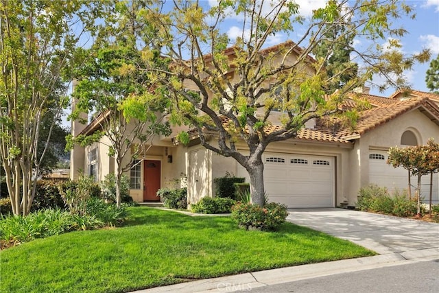 1092 Amberton Ln, Newbury Park, CA 91320 - view of front facade with stucco siding, concrete driveway, an attached garage, a front lawn, and a tile roof