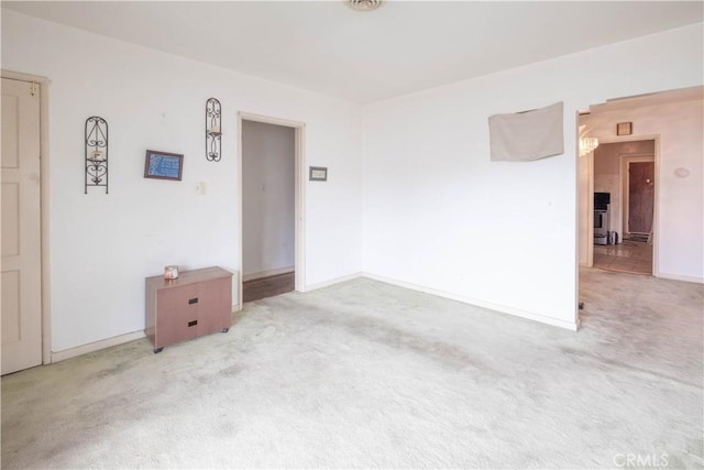 1257 E 76th Pl, Los Angeles, CA 90001 - carpeted empty room featuring baseboards