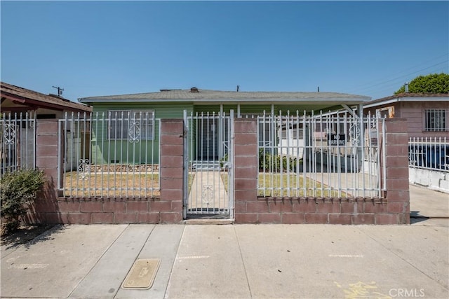 1257 E 76th Pl, Los Angeles, CA 90001 - view of front of property with a fenced front yard and a gate