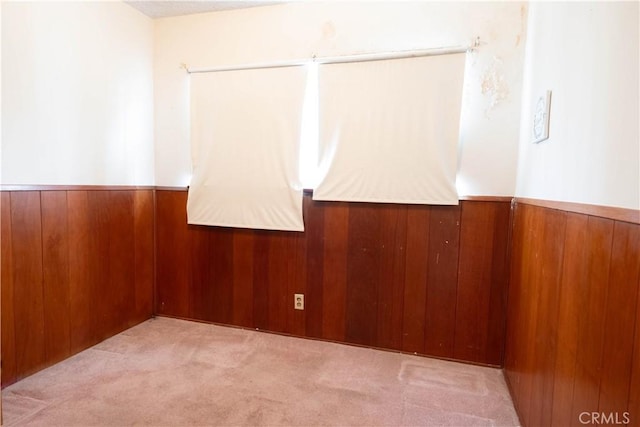 1257 E 76th Pl, Los Angeles, CA 90001 - spare room featuring carpet floors and wood walls