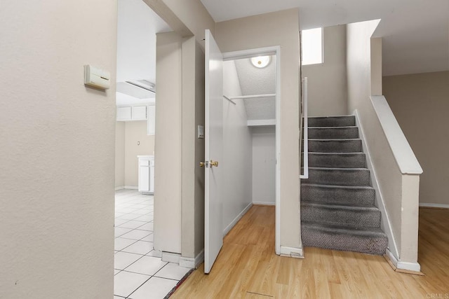 stairs featuring baseboards and wood finished floors
