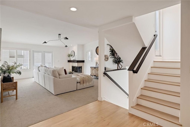 1429 Manhattan Ave, Hermosa Beach, CA 90254 - living area with light wood finished floors, recessed lighting, baseboards, a glass covered fireplace, and stairs