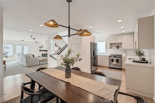 1429 Manhattan Ave, Hermosa Beach, CA 90254 - dining space with stairway, light wood-style floors, and recessed lighting