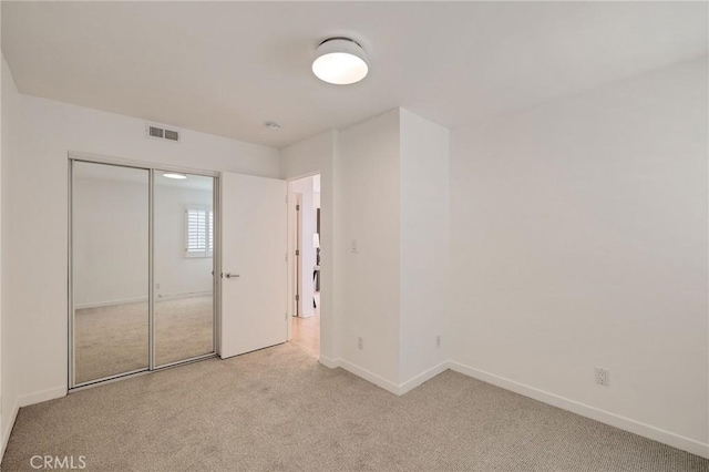 1429 Manhattan Ave, Hermosa Beach, CA 90254 - unfurnished bedroom with carpet, visible vents, baseboards, and a closet