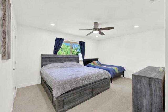 bedroom with baseboards, light carpet, recessed lighting, and a ceiling fan