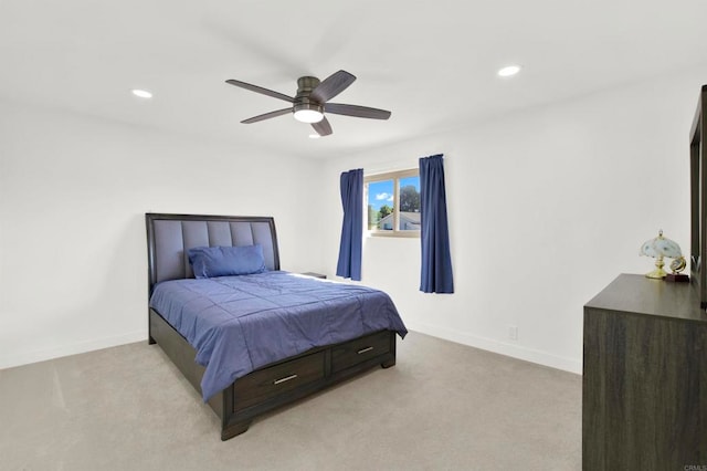 bedroom featuring light colored carpet, baseboards, a ceiling fan, and recessed lighting