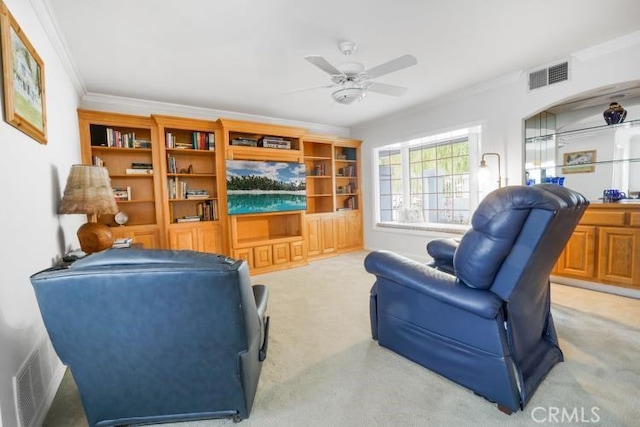 32182 Links Pointe, Laguna Niguel, CA 92677 - living room with light carpet, ceiling fan, and crown molding