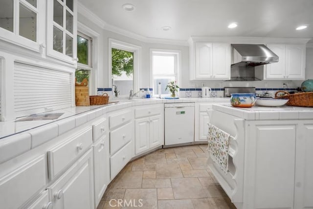 32182 Links Pointe, Laguna Niguel, CA 92677 - kitchen featuring dishwasher, tile countertops, wall chimney range hood, light stone finish flooring, and crown molding