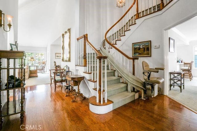 32182 Links Pointe, Laguna Niguel, CA 92677 - stairs featuring a towering ceiling and wood finished floors