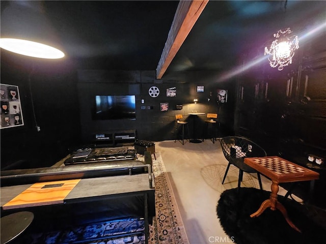 interior space featuring a notable chandelier and beam ceiling