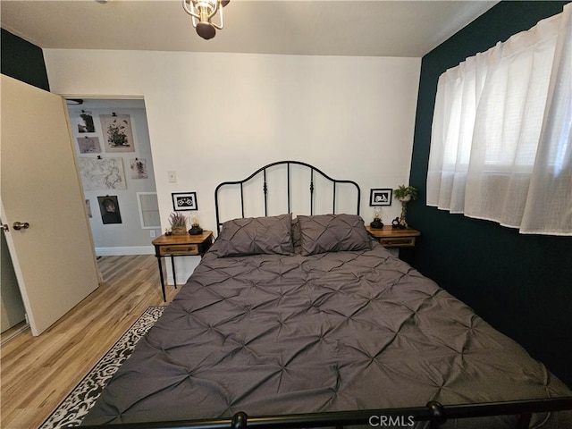 bedroom featuring light wood-style flooring