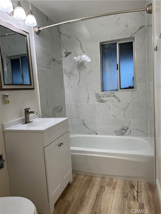 full bath with toilet, vanity, and shower / bathing tub combination