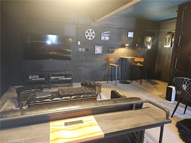 interior space with concrete block wall