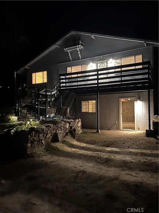 view of back of house at twilight