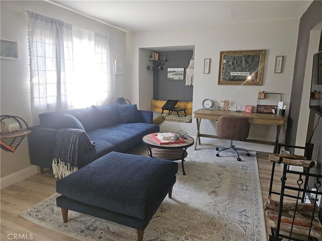 living room with wood finished floors and baseboards