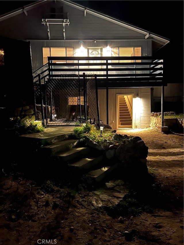 view of back of house at night
