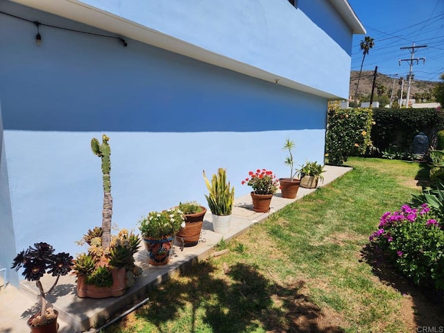 112 Barco, Ensenada Bc Mexico, CA 22870 - view of property exterior with a lawn, stucco siding, and fence