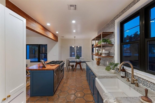 312 W Lutge Ave, Burbank, CA 91506 - kitchen with recessed lighting, blue cabinets, visible vents, a sink, and wood counters