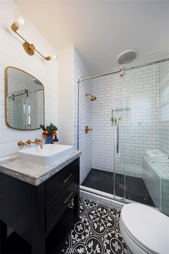 312 W Lutge Ave, Burbank, CA 91506 - bathroom featuring tile patterned floors, vanity, toilet, and a stall shower