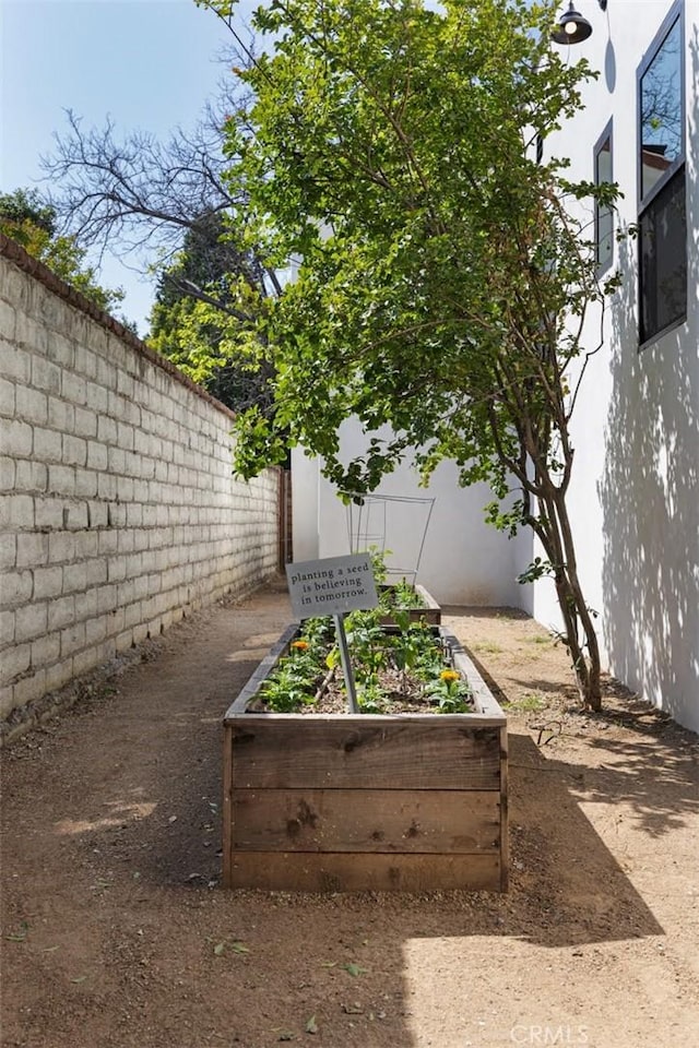 312 W Lutge Ave, Burbank, CA 91506 - view of yard featuring a vegetable garden and a fenced backyard