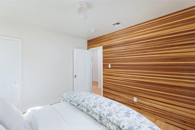 312 W Lutge Ave, Burbank, CA 91506 - bedroom featuring wooden walls, a closet, and visible vents