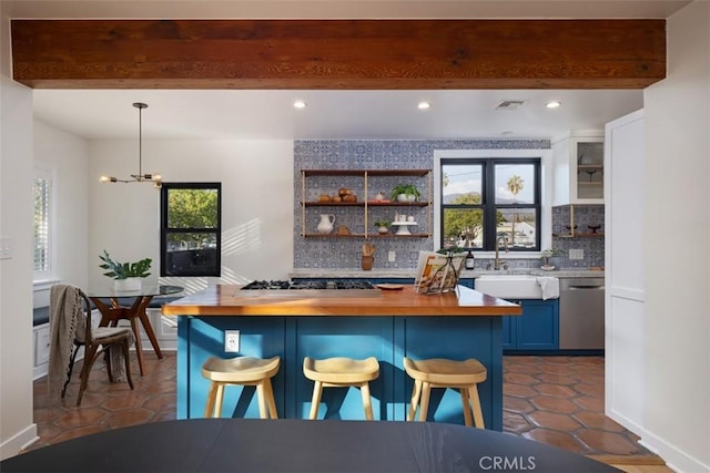 312 W Lutge Ave, Burbank, CA 91506 - kitchen featuring a sink, wood counters, stainless steel appliances, visible vents, and backsplash