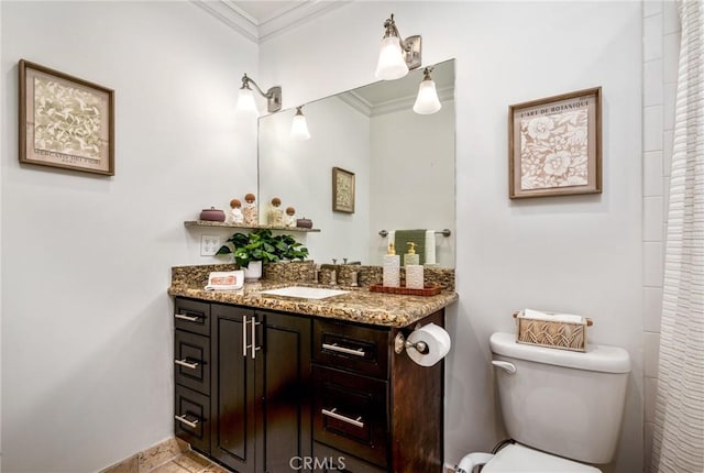 full bath with vanity, ornamental molding, baseboards, and toilet